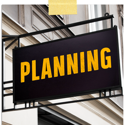 Projecting shop sign with word 'Planning' in it.